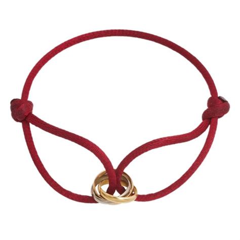 trinity bracelet by Cartier red